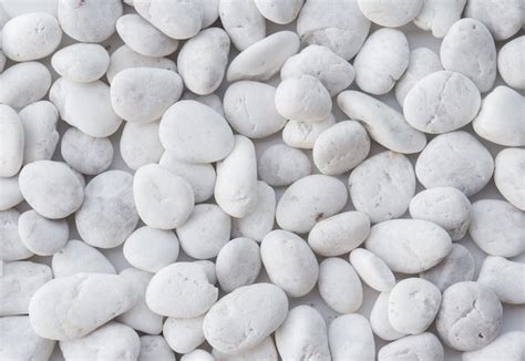 Premium Photo | White pebbles stone texture and background