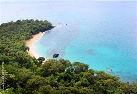 Beautiful banana beach with its turquoise waters and lush jungle on Principe island, Sao Tome ...