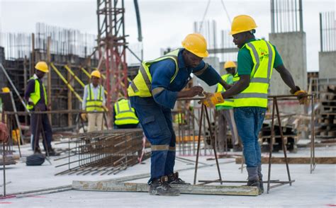 Construction Workers on the Building Site · Free Stock Photo