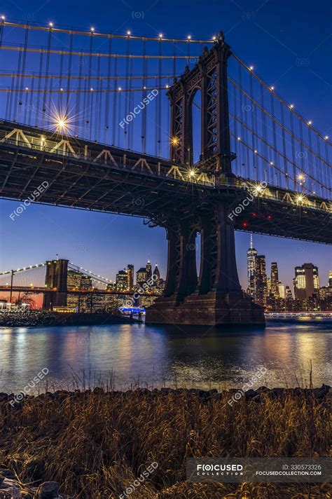 Manhattan Bridge at sunset, Brooklyn Bridge Park; Brooklyn, New York, United States of America ...