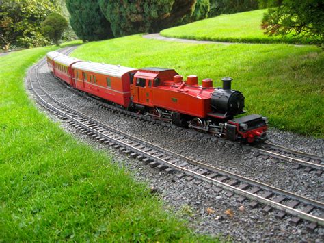 Red engine meanders through the countryside scene at Southport Model Railway Village. #LGB # ...