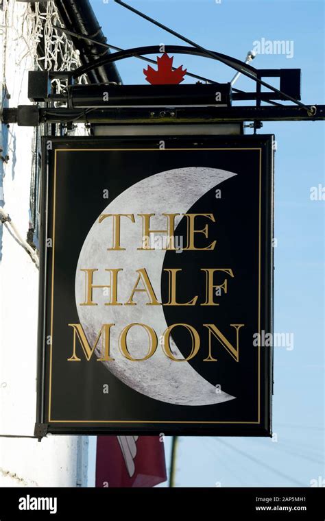 The Half Moon pub sign, Wolston, Warwickshire, England, UK Stock Photo ...