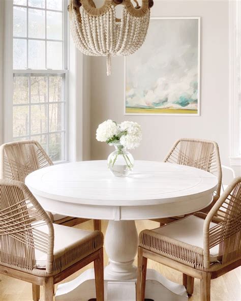 A review of our new white dining table with a pedestal that is ...