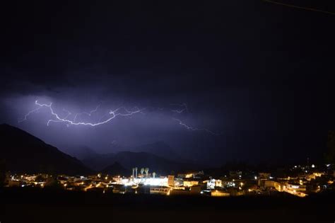 Premium Photo | Lightning in sky over city at night