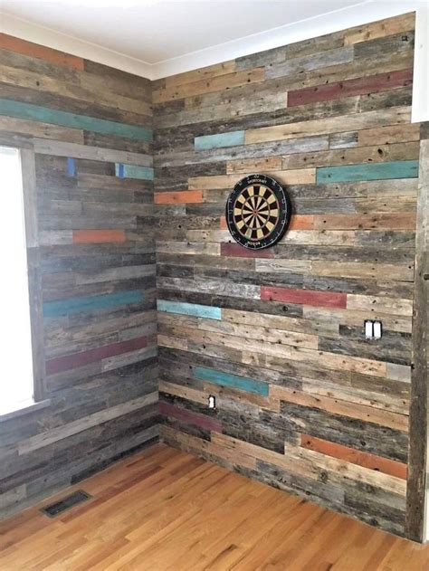 a room with wood paneling and a dart on the wall