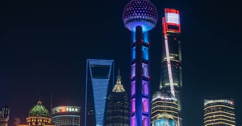 Illuminated Modern Buildings at Night · Free Stock Photo