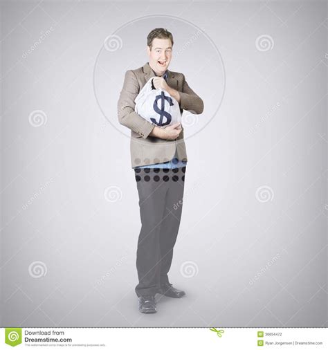 Surprised Business Man Holding Money Bag In Bank Stock Photo - Image of ...