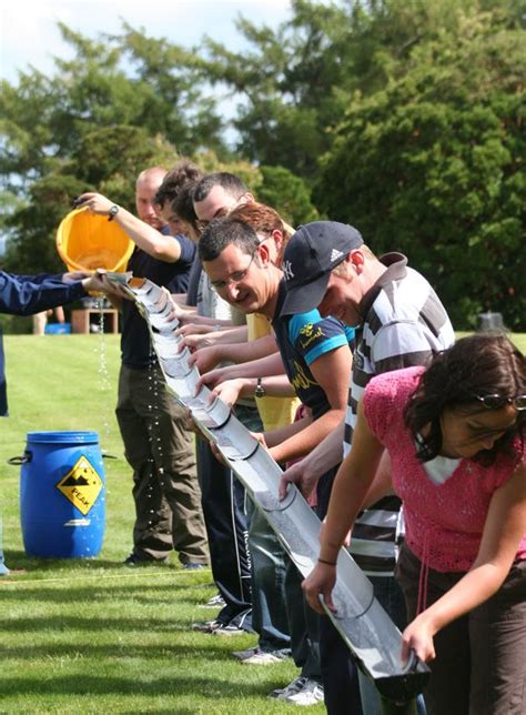 Teams see how much water they can catch in the final bucket. Multiple Teams Youth Group Games ...