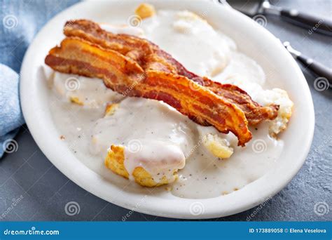 Biscuits and Gravy with Bacon for Breakfast Stock Photo - Image of pork, meat: 173889058