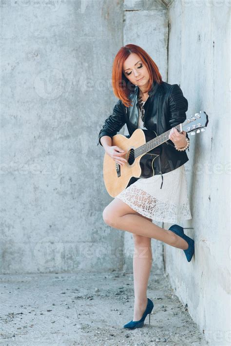 young girl with red hair with an acoustic guitar 2377149 Stock Photo at ...