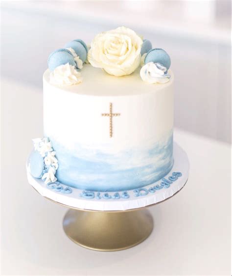 a white and blue cake sitting on top of a table