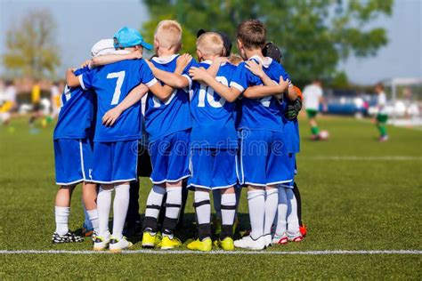 Boys` Sports Team Huddling. Children Playing Sports in a Team. Team ...