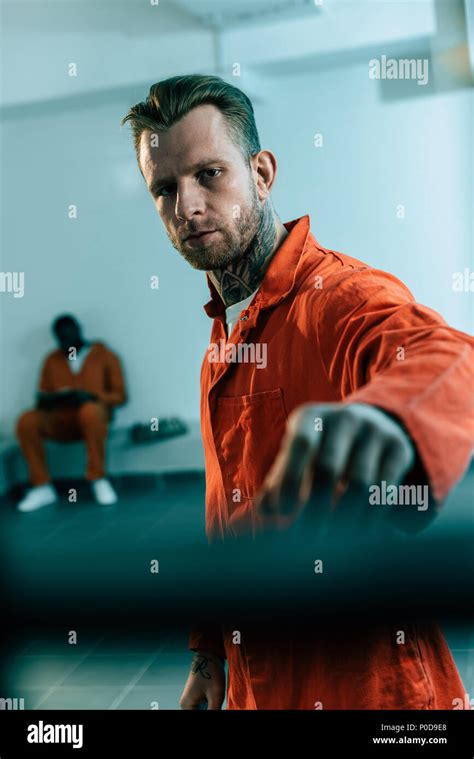 Prisoners behind bars hi-res stock photography and images - Alamy