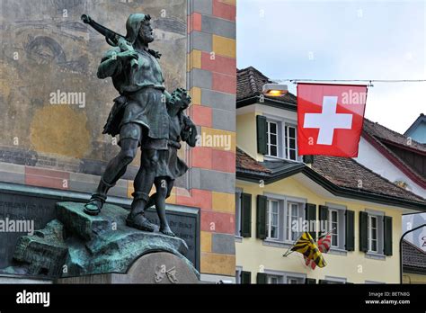 Statue of Swiss medieval folk hero William Tell / Wilhelm Tell with son and crossbow in the city ...