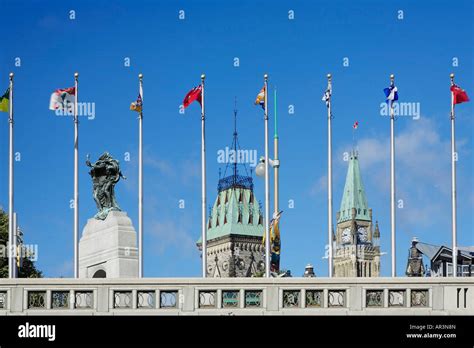 Parliament Hill sits in the backdrop of flags in Ottawa Parliament Hill ...