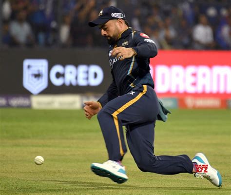 Mumbai : GT's Rashid Khan fields to save a boundary during the IPL 2023 ...