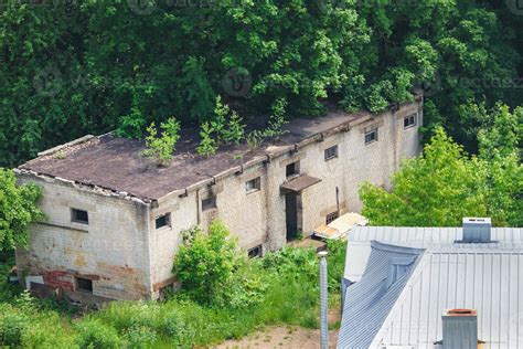 Urban landscape with old warehouse and green trees in summer Kaunas 5125843 Stock Photo at Vecteezy