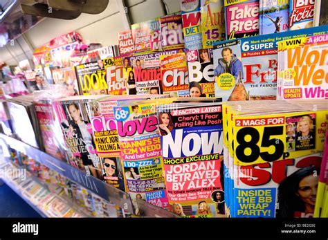 Magazines on a stand in a newsagents Stock Photo - Alamy