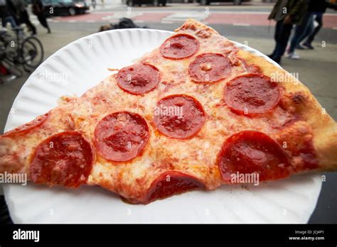 large single slice of pepperoni pizza New York City USA Stock Photo - Alamy