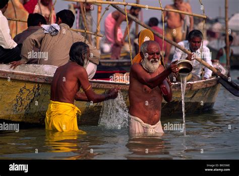 India, Uttar Pradesh, Allahabad, Sangam, people bathing at the confluence of the rivers Ganges ...