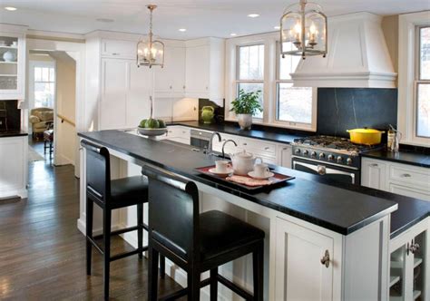 Transform Your Kitchen with White Cabinets, Black Countertops, and Wood Floors - Click Here to ...