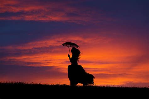 Silhouette of young woman running at sunset Photograph by Maggie Mccall ...