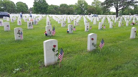 Hundreds observe Memorial Day under gray skies at Fort Snelling National Cemetery | MPR News