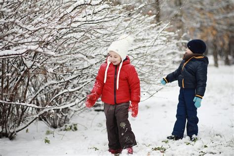 Premium Photo | Children in winter park play