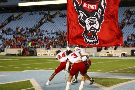 NC State Plants Team Flag In Middle Of North Carolina field After Upset ...