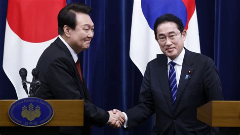 Japan and South Korea renew ties in first summit in 12 years : NPR