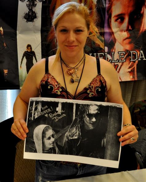 Rochelle Davis holding a picture of herself and Brandon Lee - The Crow ...