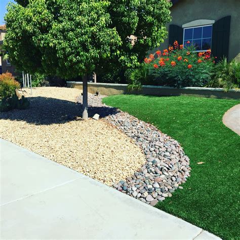 Artificial turf/Rock design | Grass backyard, Arizona backyard, Front yard landscaping