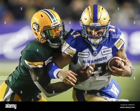 Winnipeg Blue Bombers quarterback Chris Streveler, right, runs the ball ...