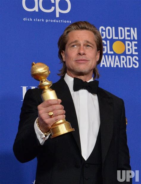 Photo: Brad Pitt wins an award at the 77th Golden Globe Awards in ...