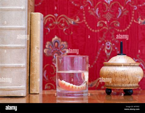 Dentures on bedside table Stock Photo - Alamy