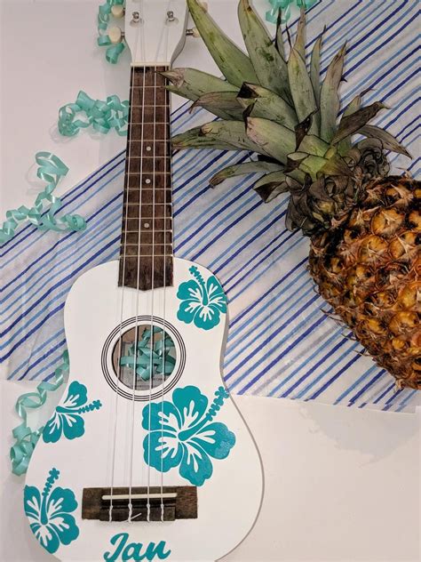 Check out this fun ukulele that is perfect to add a touch of Hawaiiana to any room. Personali ...