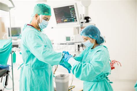 Assistant Helping a Surgeon in the or Stock Image - Image of equipment ...