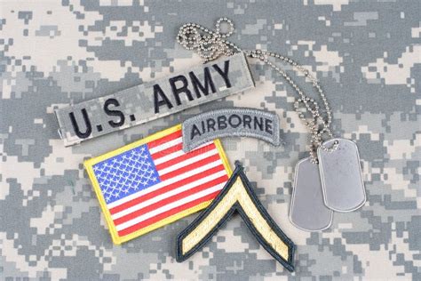 US ARMY Private Rank Patch, Airborne Tab, Flag Patch, with Dog Tag on Camouflage Uniform Stock ...