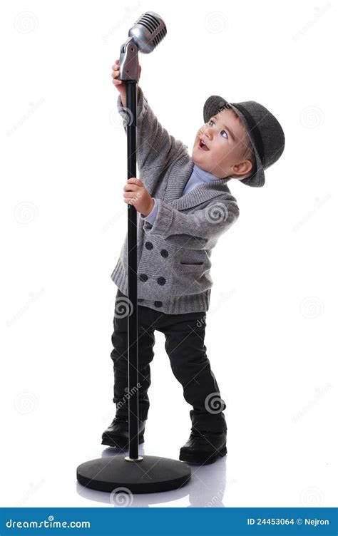 Smiling Boy Holding A Microphone Stand Stock Images - Image: 24453064