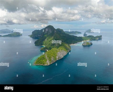 Drone view of green mountain and beaches. Cadlao Island in El Nido ...