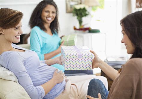 Pregnant woman having baby shower stock photo