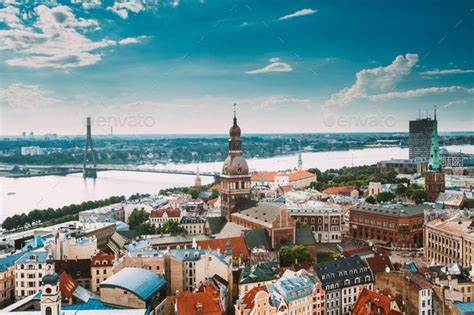 Riga, Latvia. Riga Cityscape Slyline In Sunny Summer Day. Famous Landmarks - Riga Dome Cathedral And