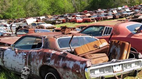 Old abandoned drag and rare cars in junkyard. Abandoned Muscle Cars In ...