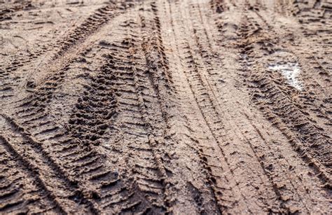 Premium Photo | Motorcycle and car tire track print on sand or mud with selective focus