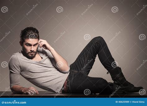 Man Lying Down on the Floor and Thinking Stock Image - Image of jeans ...