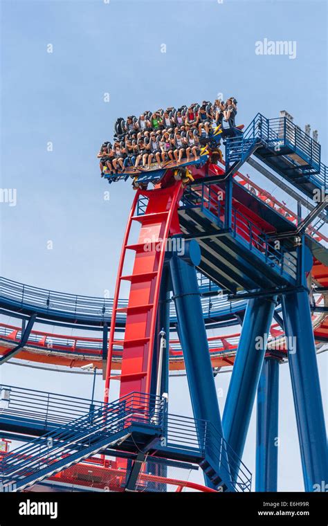 Park guests ride the SheiKra roller coaster at Busch Gardens theme park ...