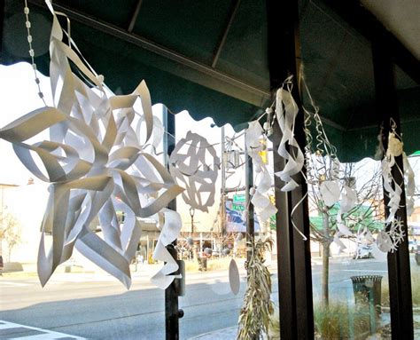 paper snowflake window display at yellow door art market Market Stall Display Ideas, Art Display ...