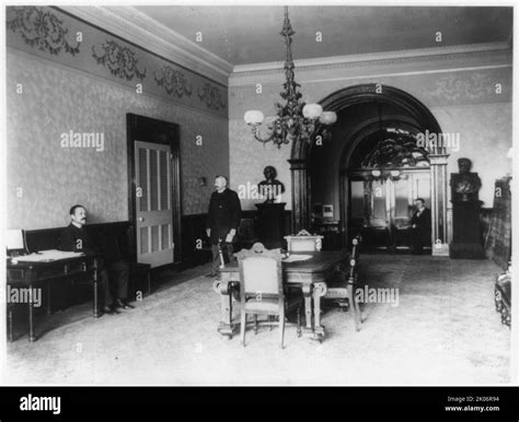 The office lobby in the White House, between 1889 and 1906. Three men ...