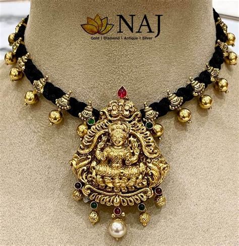 Black thread necklace with Lakshmi pendant photo | Black beaded jewelry ...