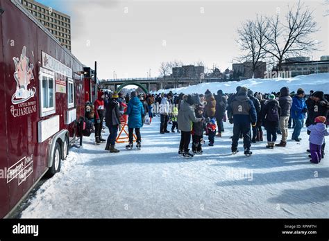 People celebrate the Winterlude festival on the frozen Rideau Canal ...